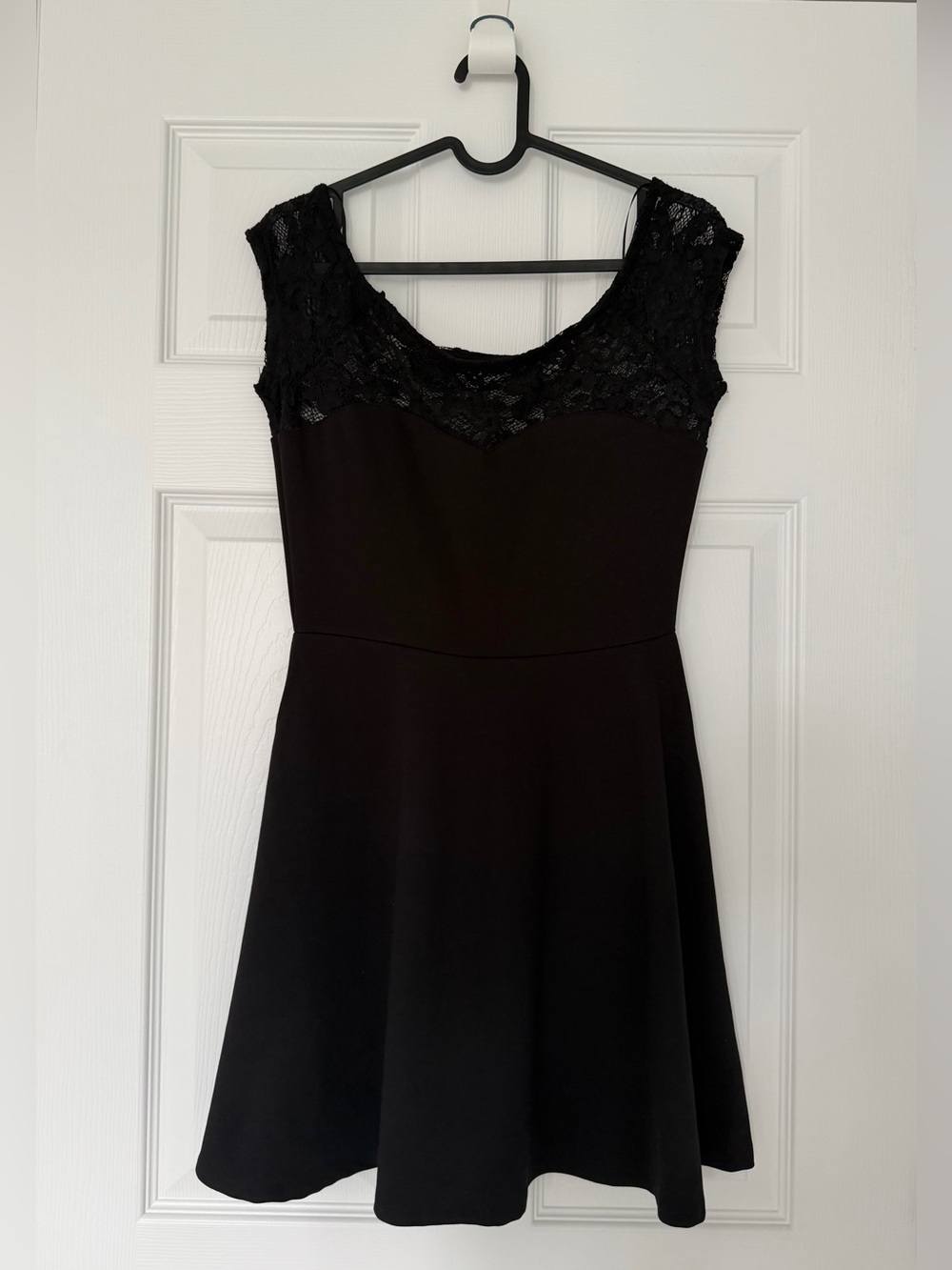 Mini black dress with lace neckline
